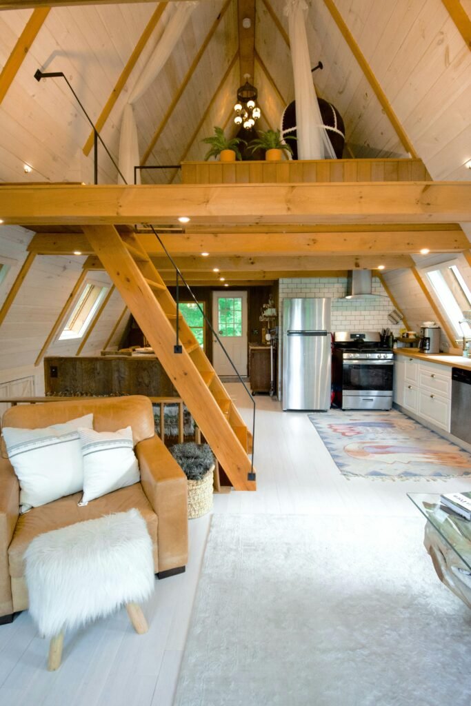 Spacious A-frame cabin interior with modern design elements, located in Stowe, Vermont.